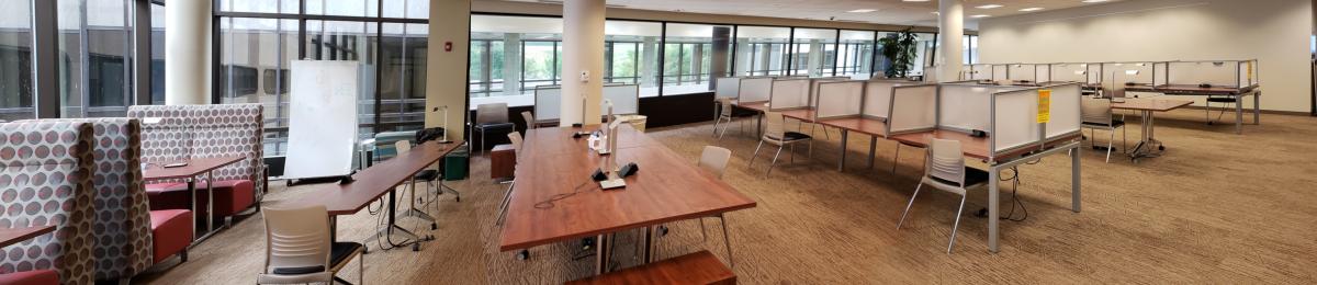Photo of the quiet study lounge shows the comfortable seatings on the left, open desk in the middle, and cubicles on the right.