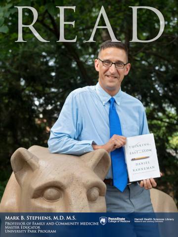 2018 Read Poster honoree Mark Stephens holding his book: Think Fast and Slow