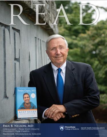 Read honoree Paul Nelson holding the book "Keep Sharp" by Sanjay Gupta M.D., Simon & Shuster, 2021